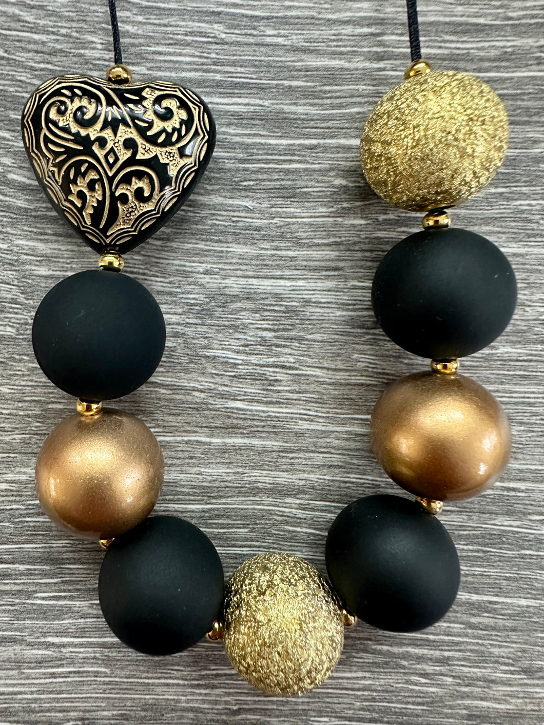 Anti-Valentine’s Day- black & gold heart statement