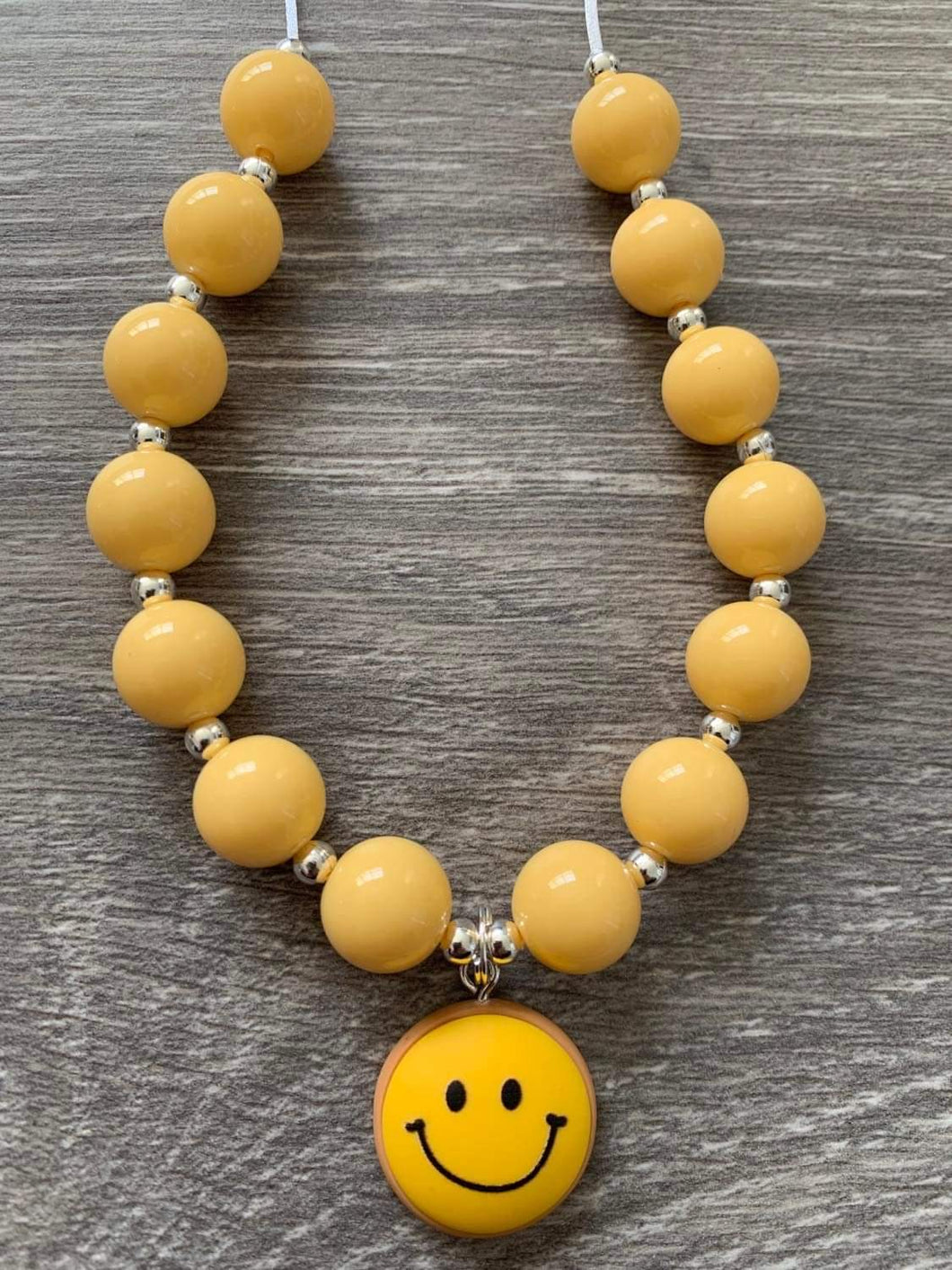 Peace, Love & LPD- smiley skinny pendant yellow